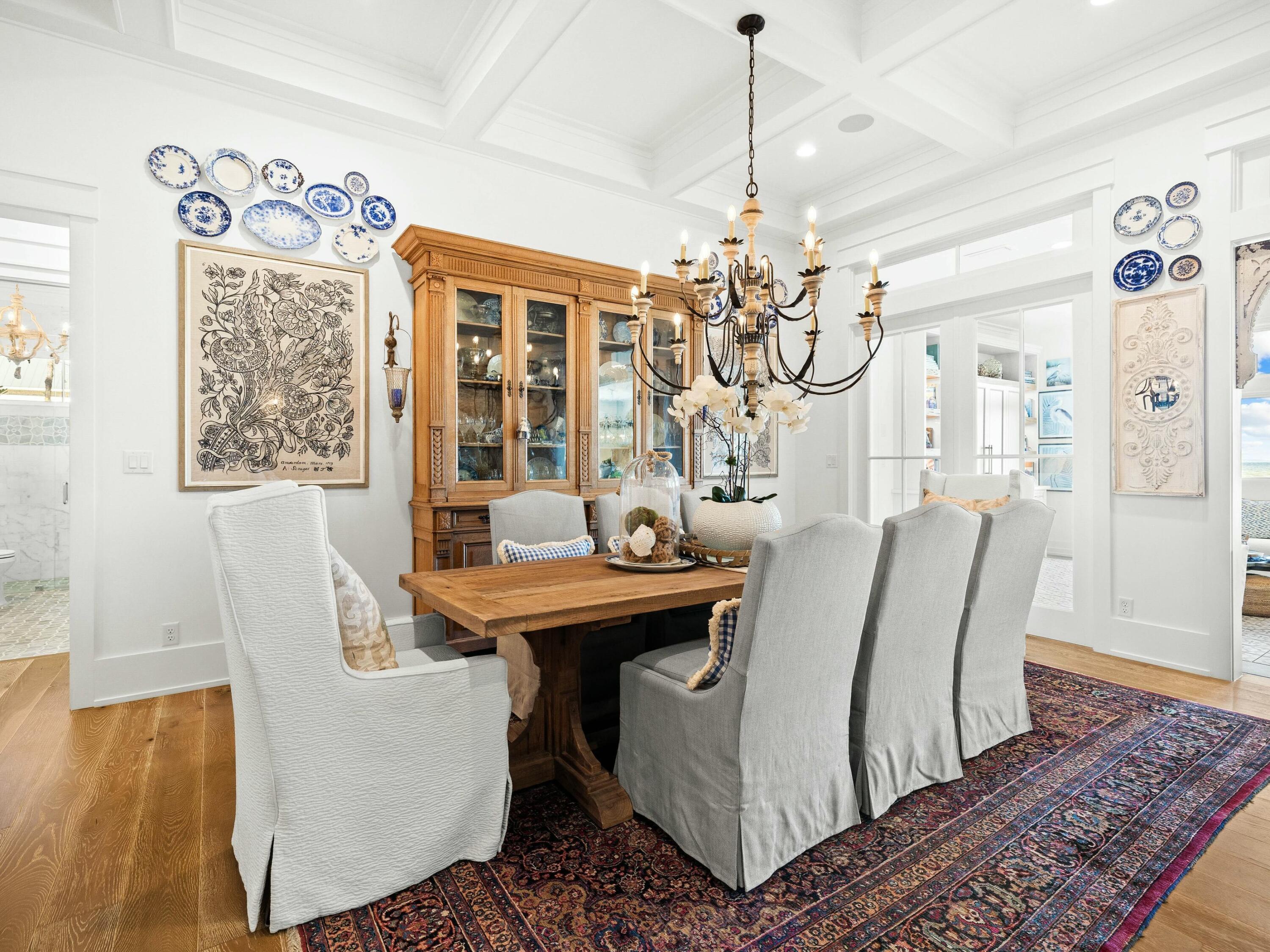 1521 Driftwood Point Road Santa Rosa Beach, FL 32459 - Photo 15 of 55 a view of a dining room with furniture wooden floor and chandelier