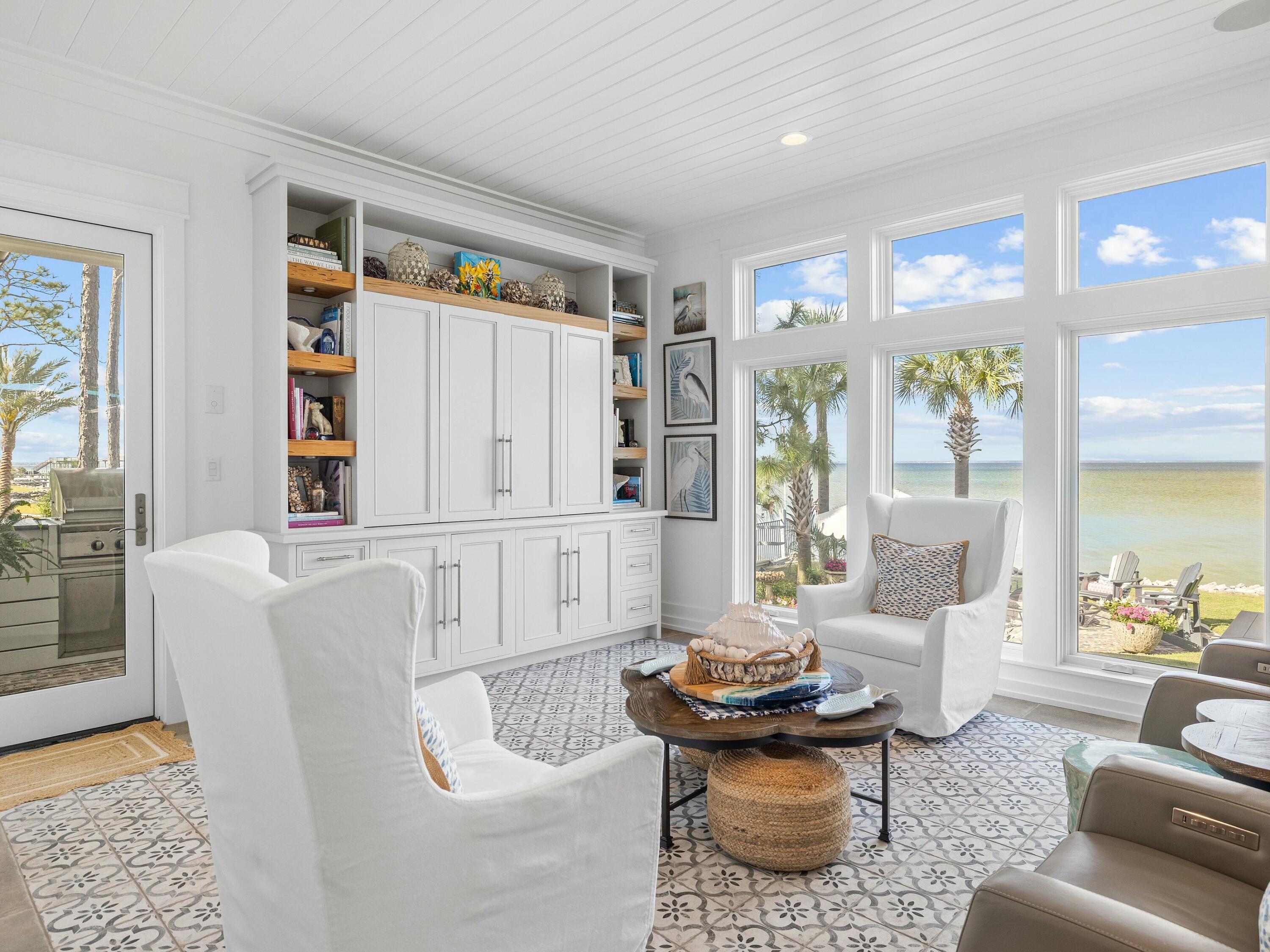 1521 Driftwood Point Road Santa Rosa Beach, FL 32459 - Photo 18 of 55 a living room with furniture potted plant next to a window