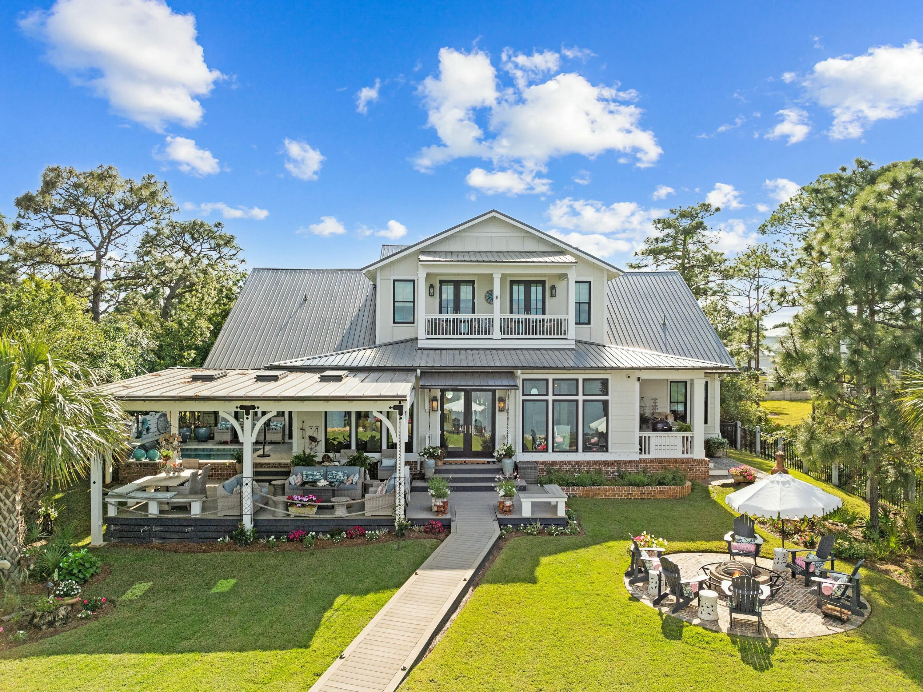 1521 Driftwood Point Road Santa Rosa Beach, FL 32459 - Photo 2 of 55 a view of a house with swimming pool yard and patio