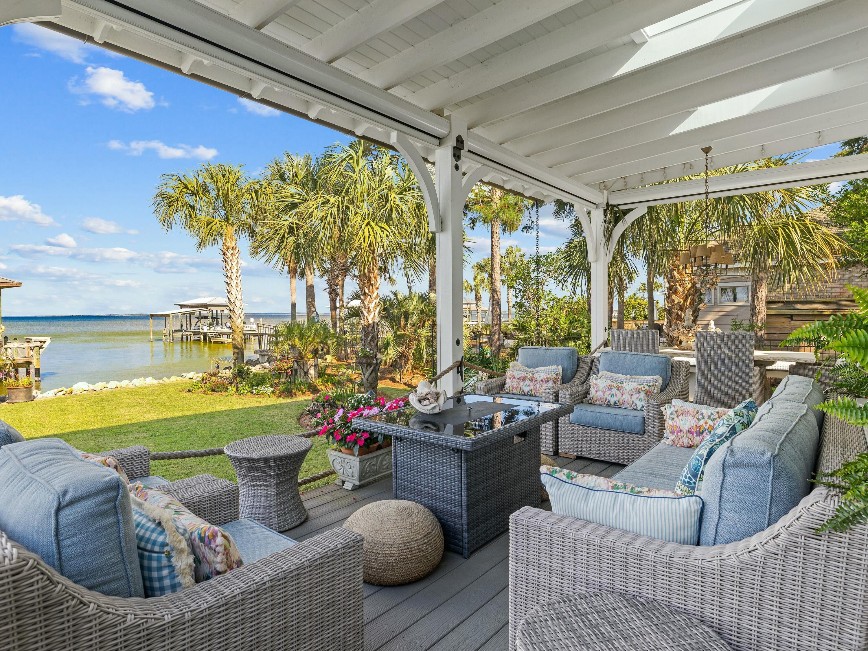 1521 Driftwood Point Road Santa Rosa Beach, FL 32459 - Photo 21 of 55 a living room with furniture and a large window