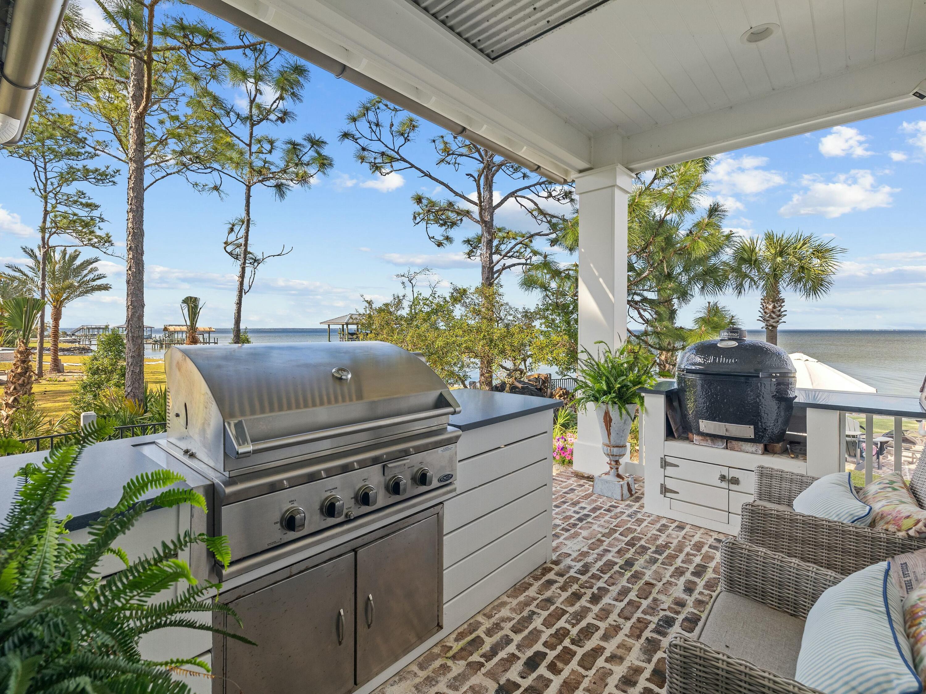1521 Driftwood Point Road Santa Rosa Beach, FL 32459 - Photo 25 of 55 a kitchen with a stove and a potted plant