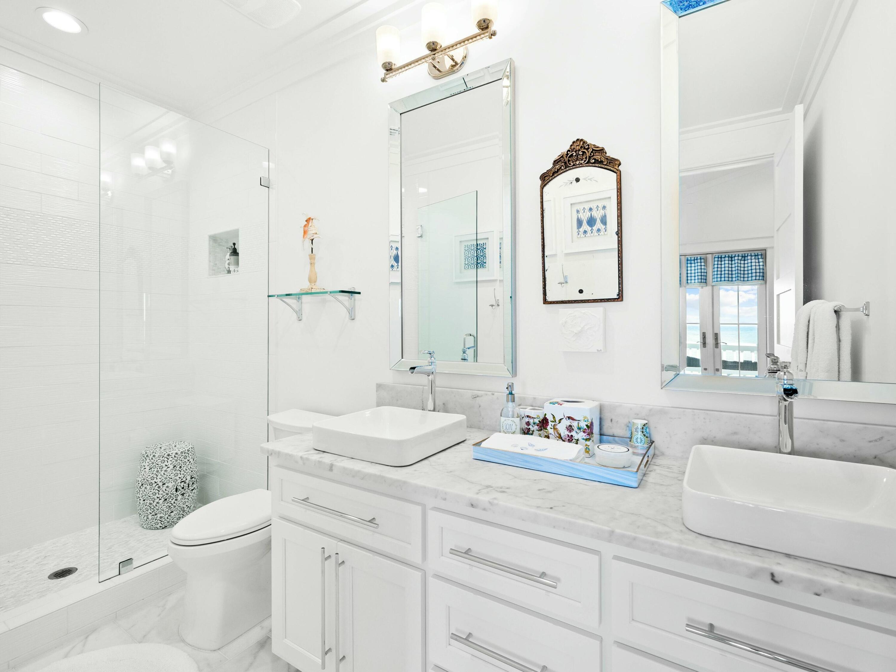 1521 Driftwood Point Road Santa Rosa Beach, FL 32459 - Photo 38 of 55 a bathroom with a granite countertop sink mirror vanity and toilet