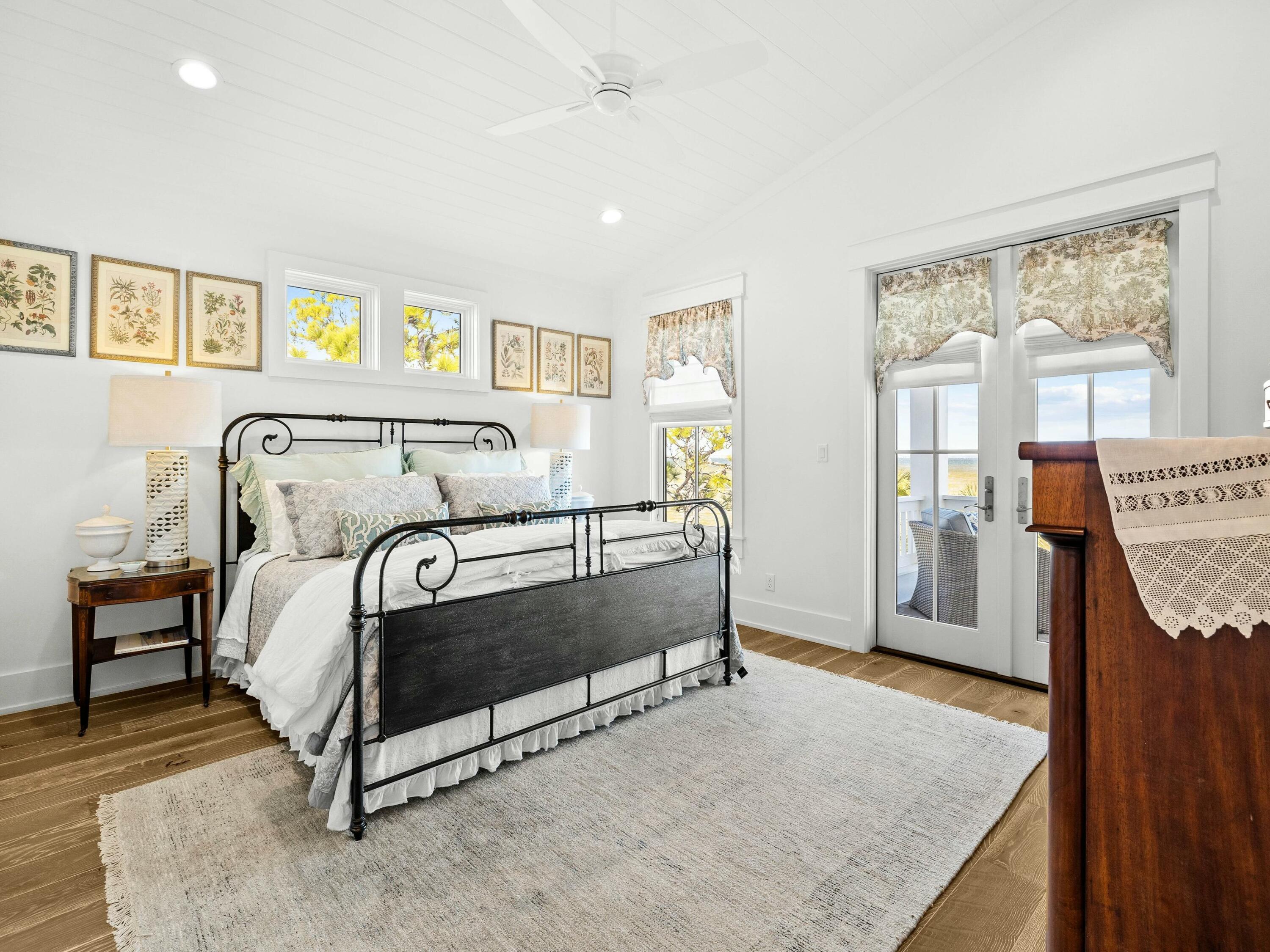 1521 Driftwood Point Road Santa Rosa Beach, FL 32459 - Photo 39 of 55 a bedroom with a bed and wooden floor