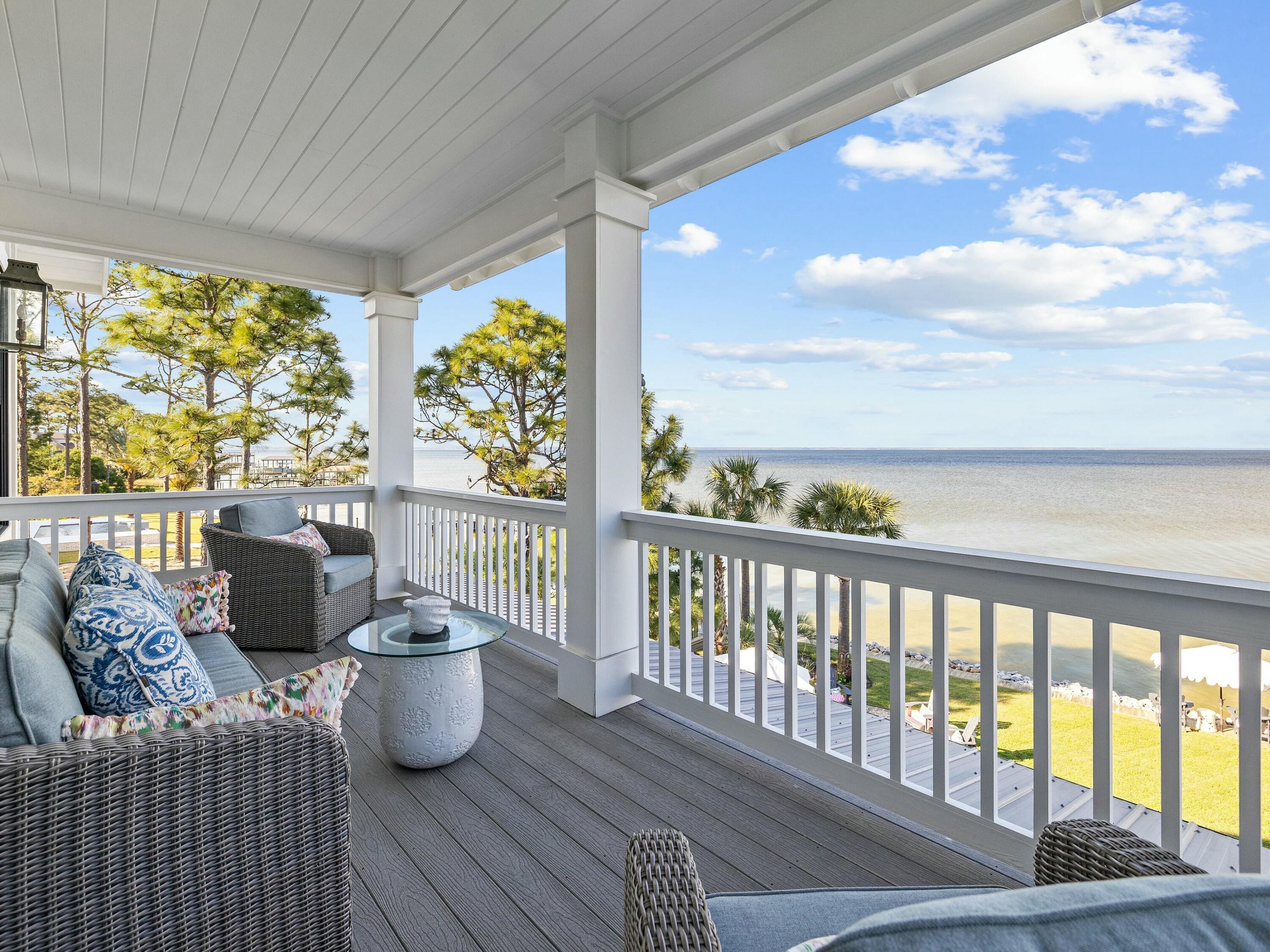 1521 Driftwood Point Road Santa Rosa Beach, FL 32459 - Photo 42 of 55 a view of a chairs and table on the balcony
