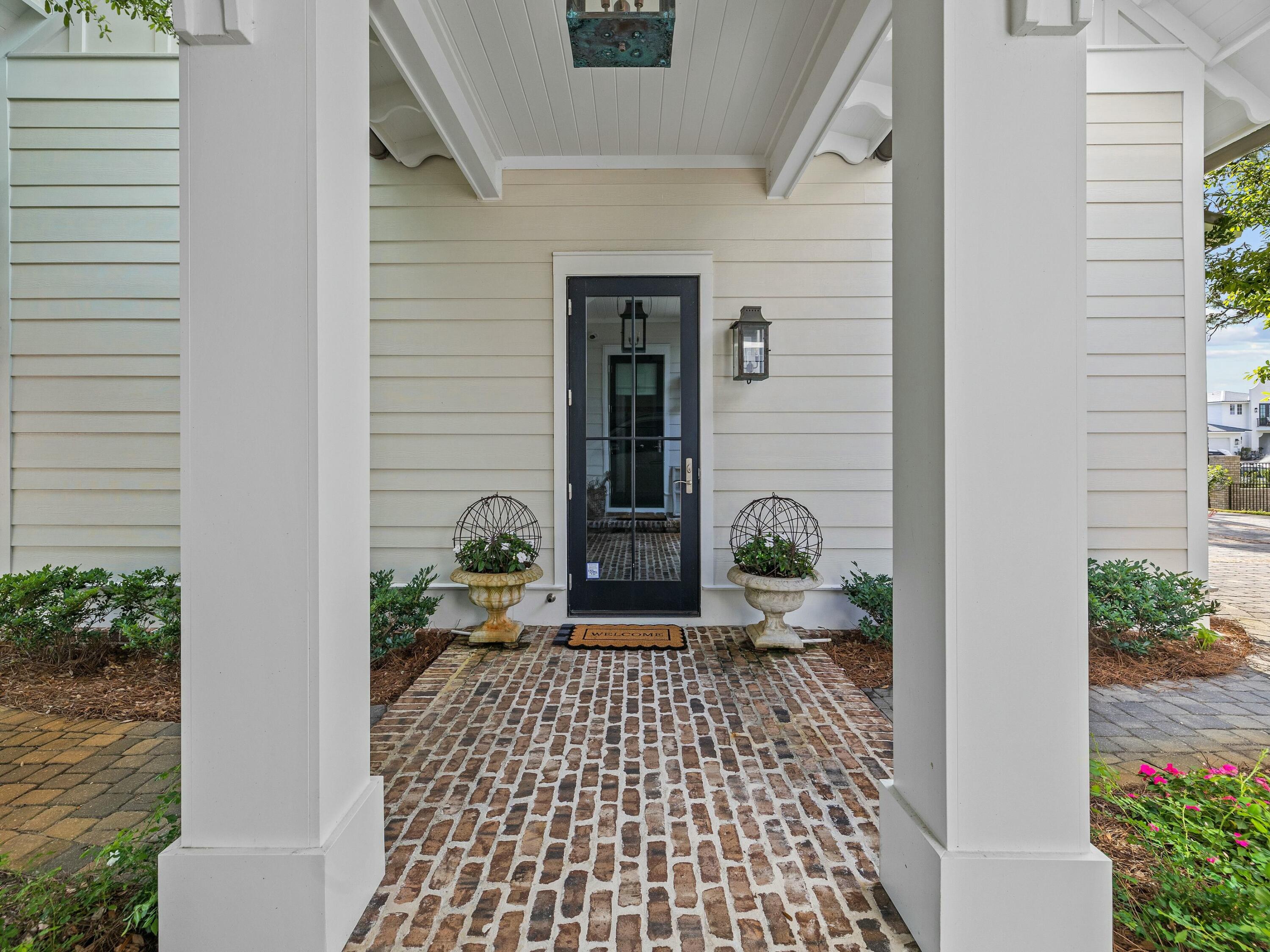 1521 Driftwood Point Road Santa Rosa Beach, FL 32459 - Photo 44 of 55 a view of a door and chair in a patio
