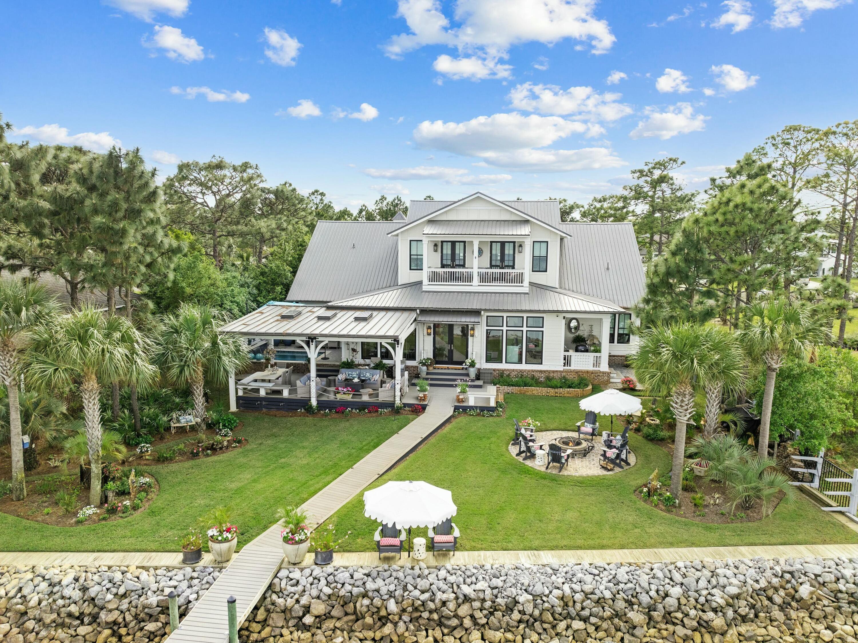 1521 Driftwood Point Road Santa Rosa Beach, FL 32459 - Photo 50 of 55 a view of a house with a yard balcony and sitting area