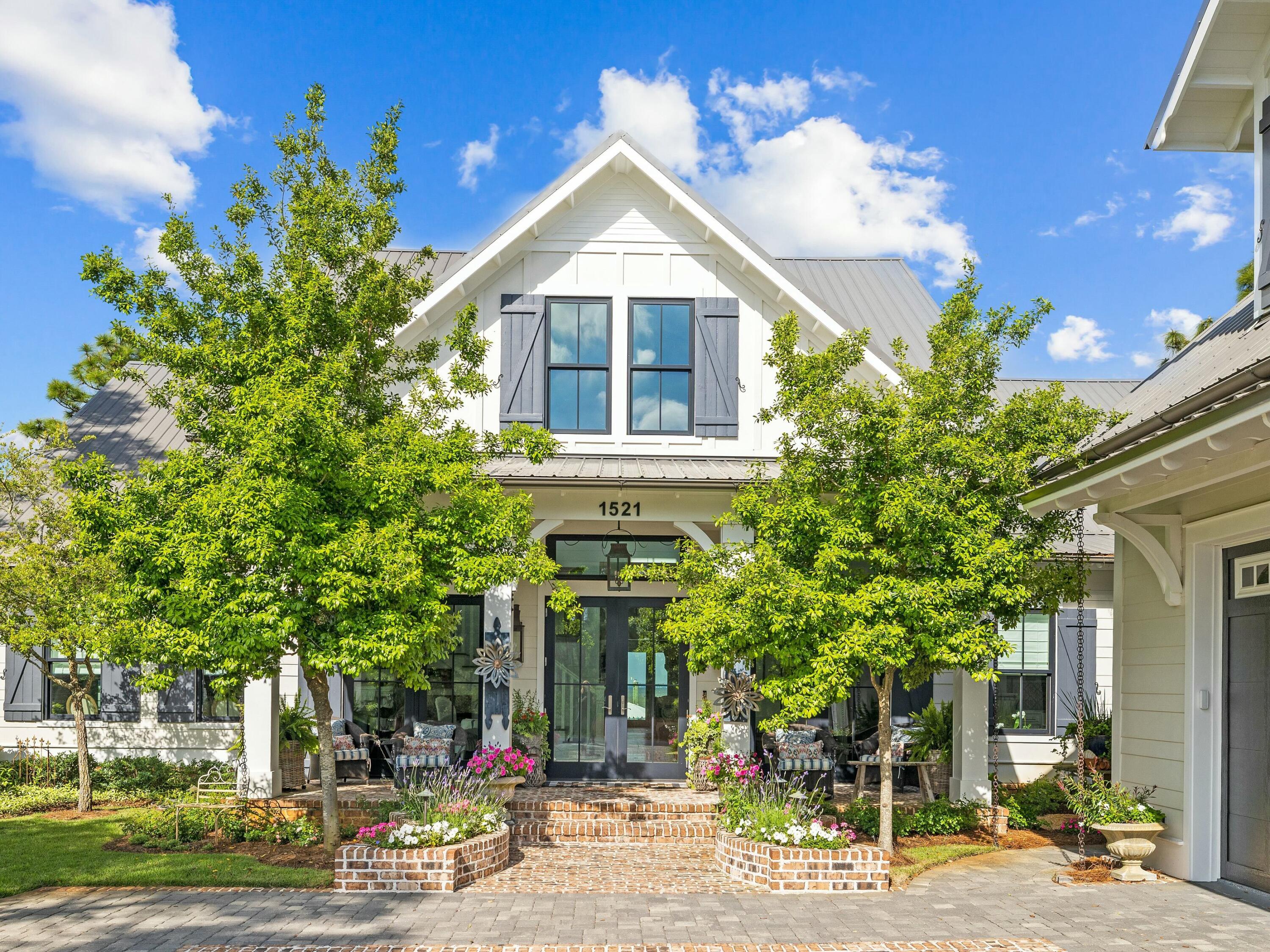 1521 Driftwood Point Road Santa Rosa Beach, FL 32459 - Photo 5 of 55 a front view of a house with a yard