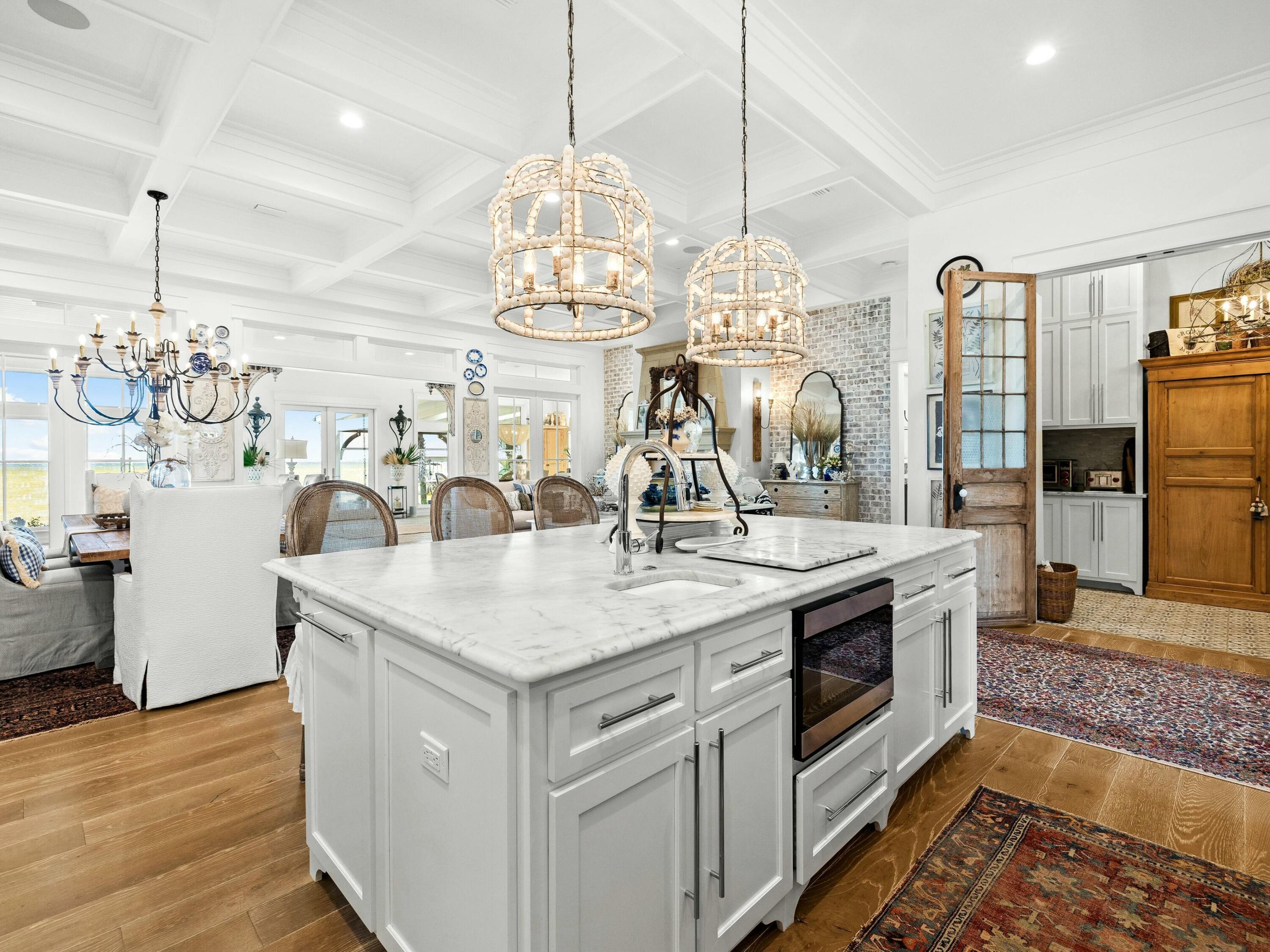 1521 Driftwood Point Road Santa Rosa Beach, FL 32459 - Photo 10 of 55 a kitchen with stainless steel appliances granite countertop a sink a stove top oven a counter space and cabinets