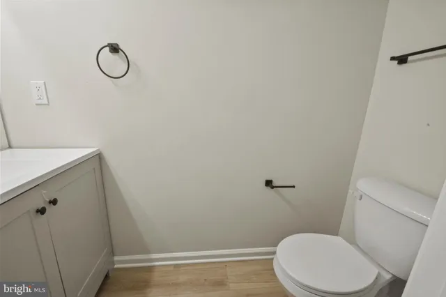 a bathroom with a toilet and a sink