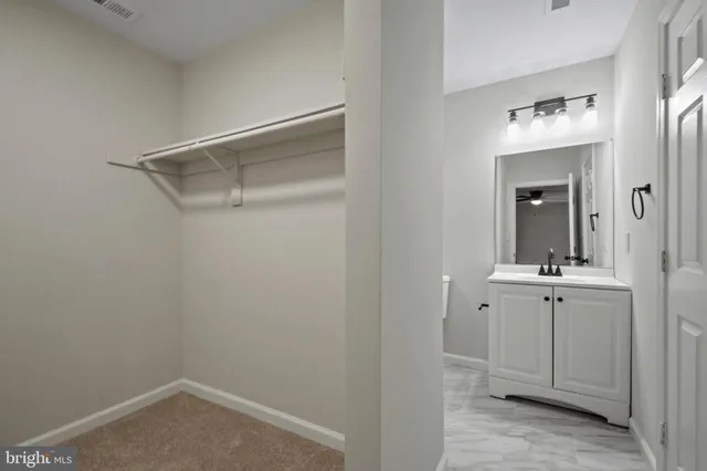 a bathroom with a sink and mirror