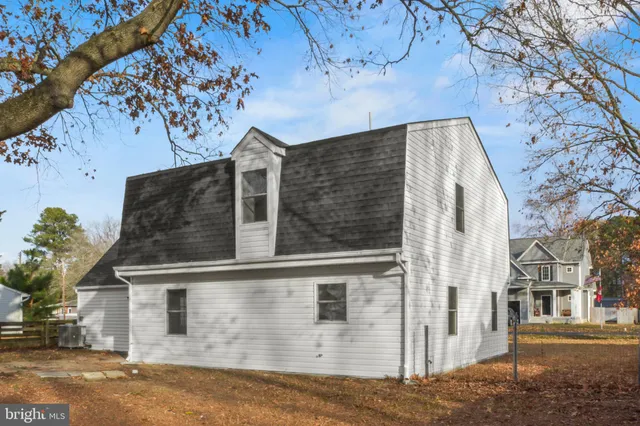 front view of a house with a tree