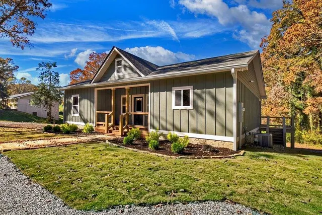 a front view of a house with garden