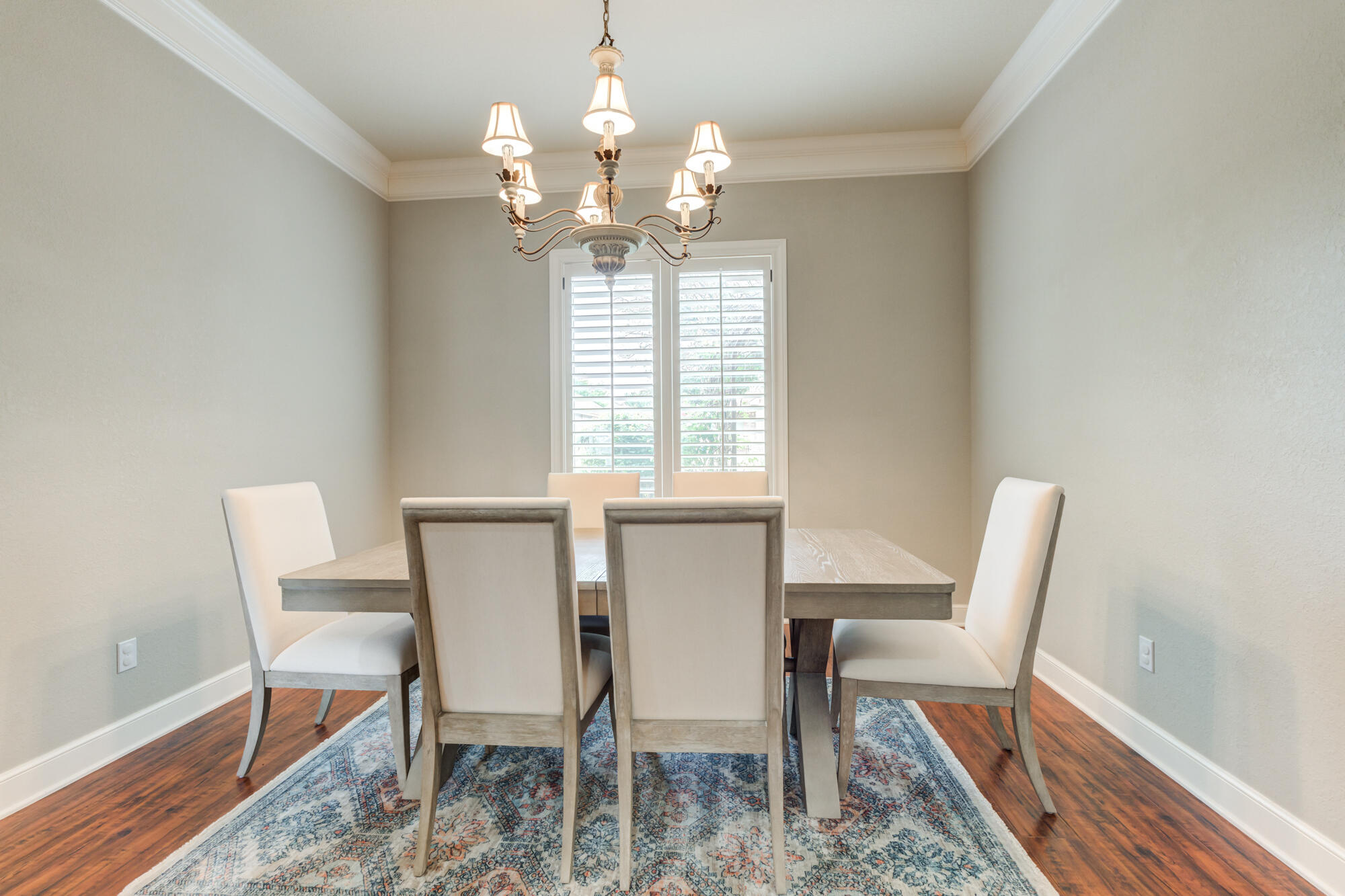 6020 85th Street Lubbock, TX 79424 - Photo 11 of 58 a dining room with furniture a rug and wooden floor