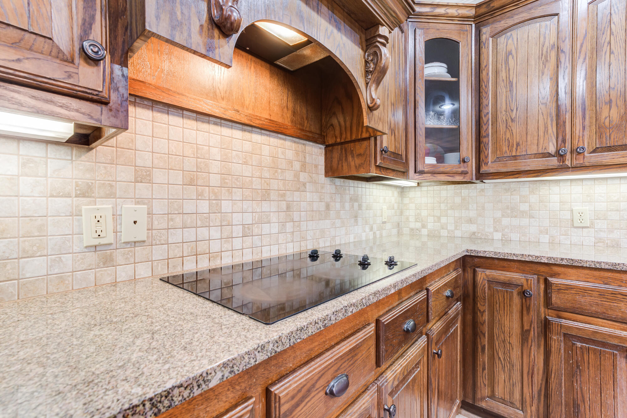 6020 85th Street Lubbock, TX 79424 - Photo 14 of 58 a bathroom with a granite countertop sink and a mirror