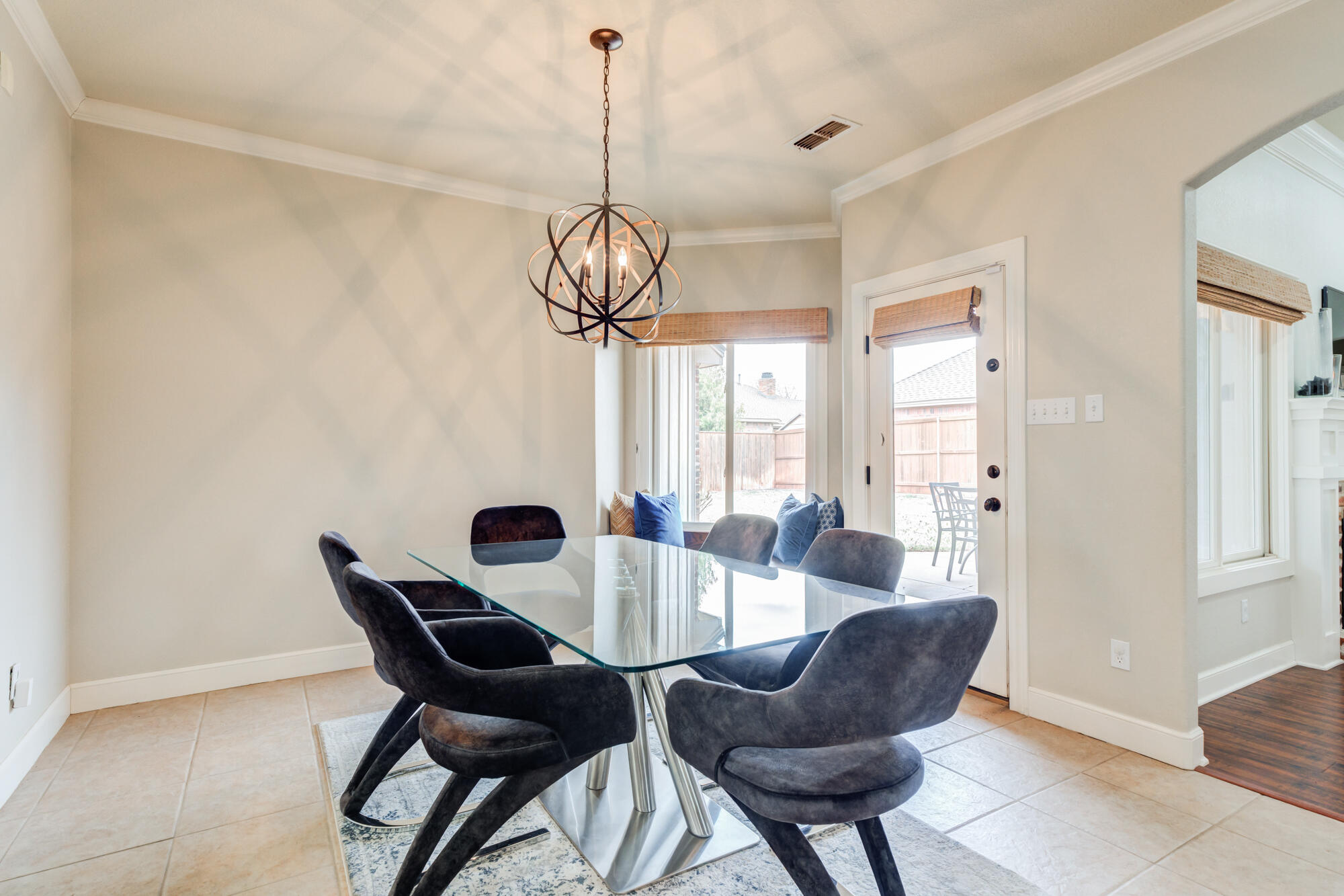 6020 85th Street Lubbock, TX 79424 - Photo 21 of 58 a view of a dining room with furniture window and wooden floor