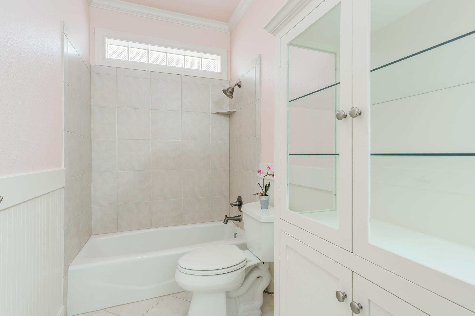 6020 85th Street Lubbock, TX 79424 - Photo 36 of 58 a bathroom with a shower a bathtub and toilet