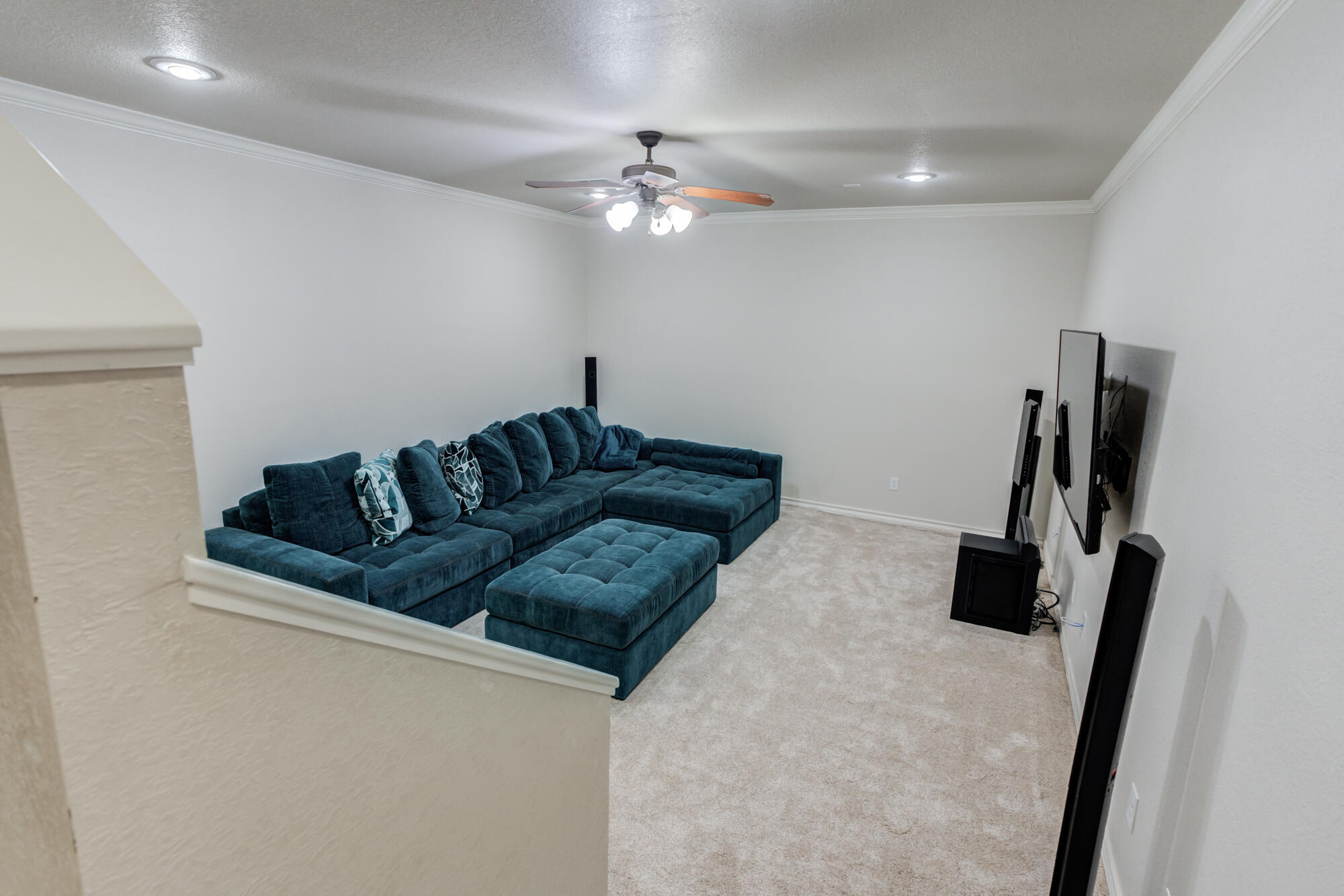 6020 85th Street Lubbock, TX 79424 - Photo 45 of 58 a living room with furniture and a flat screen tv