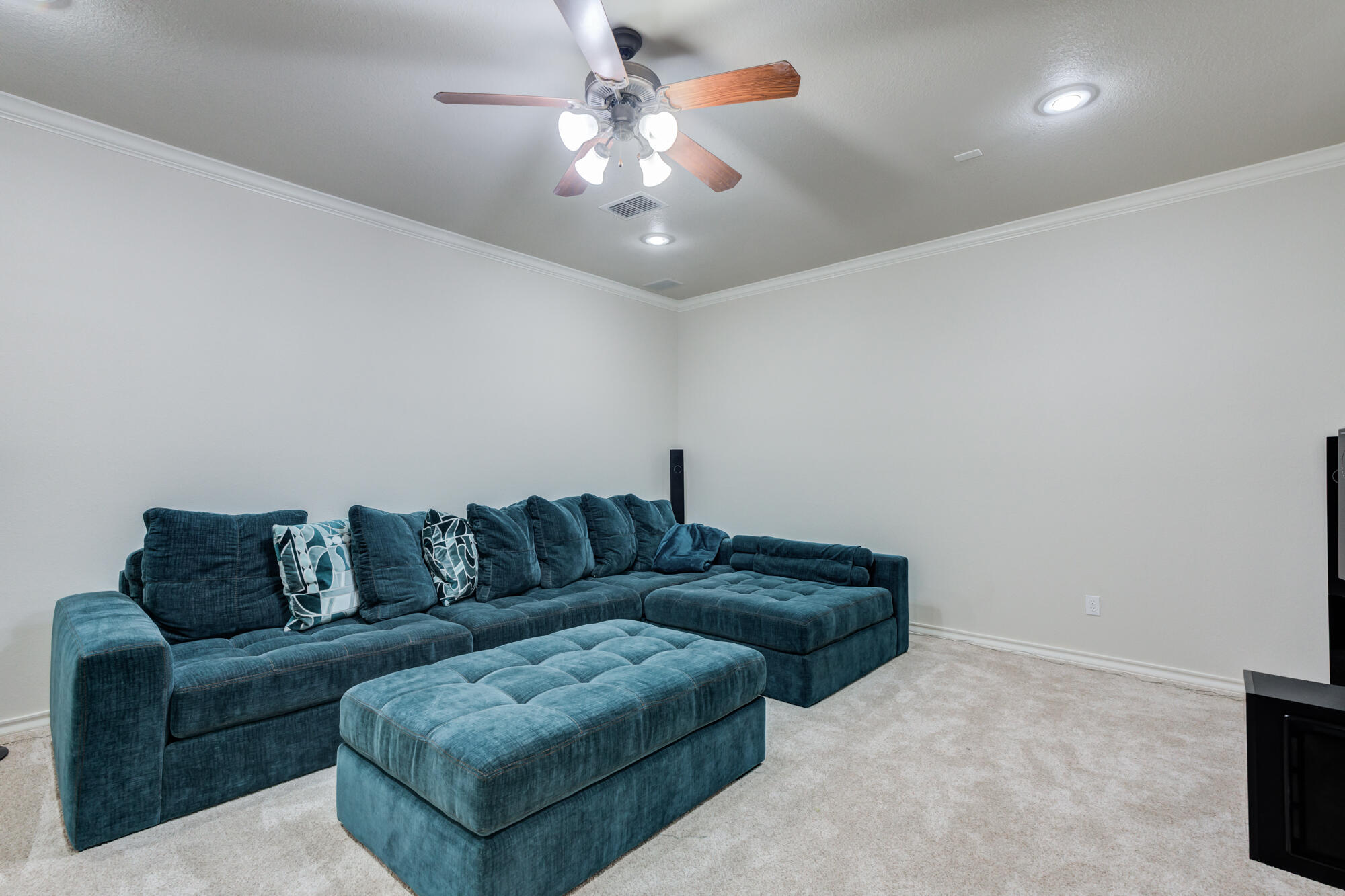 6020 85th Street Lubbock, TX 79424 - Photo 46 of 58 a living room with furniture and a chandelier