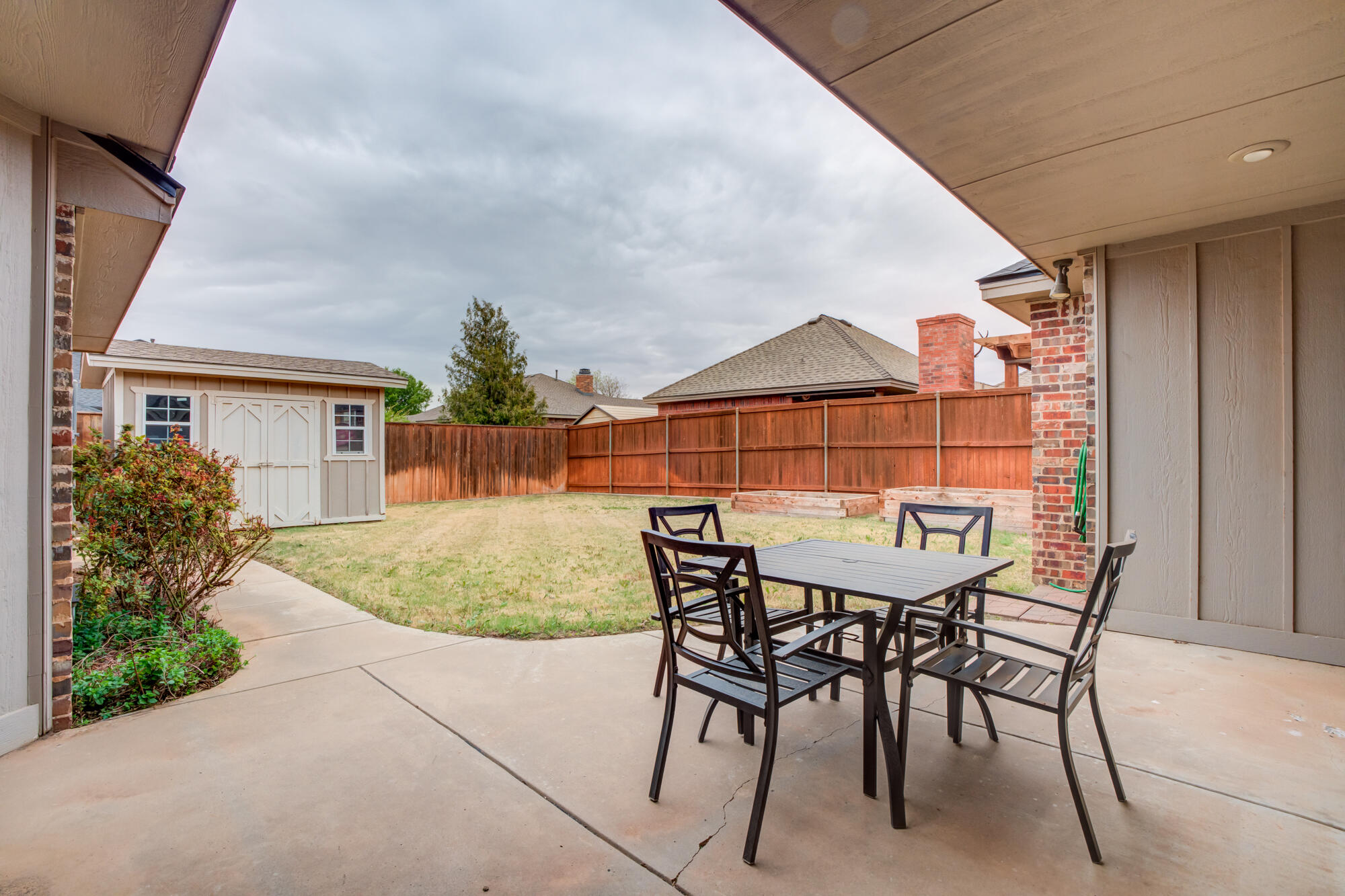 6020 85th Street Lubbock, TX 79424 - Photo 52 of 58 a view of a house with backyard and sitting area