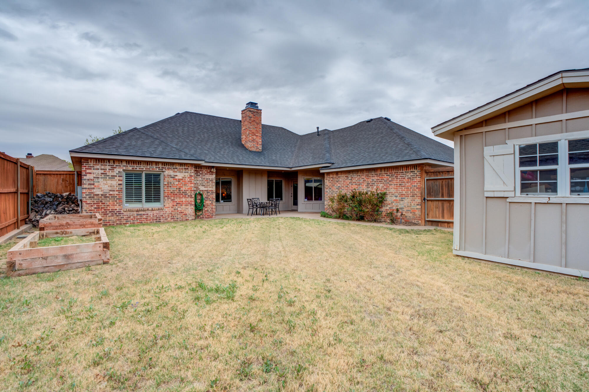 6020 85th Street Lubbock, TX 79424 - Photo 54 of 58 a front view of a house with a yard