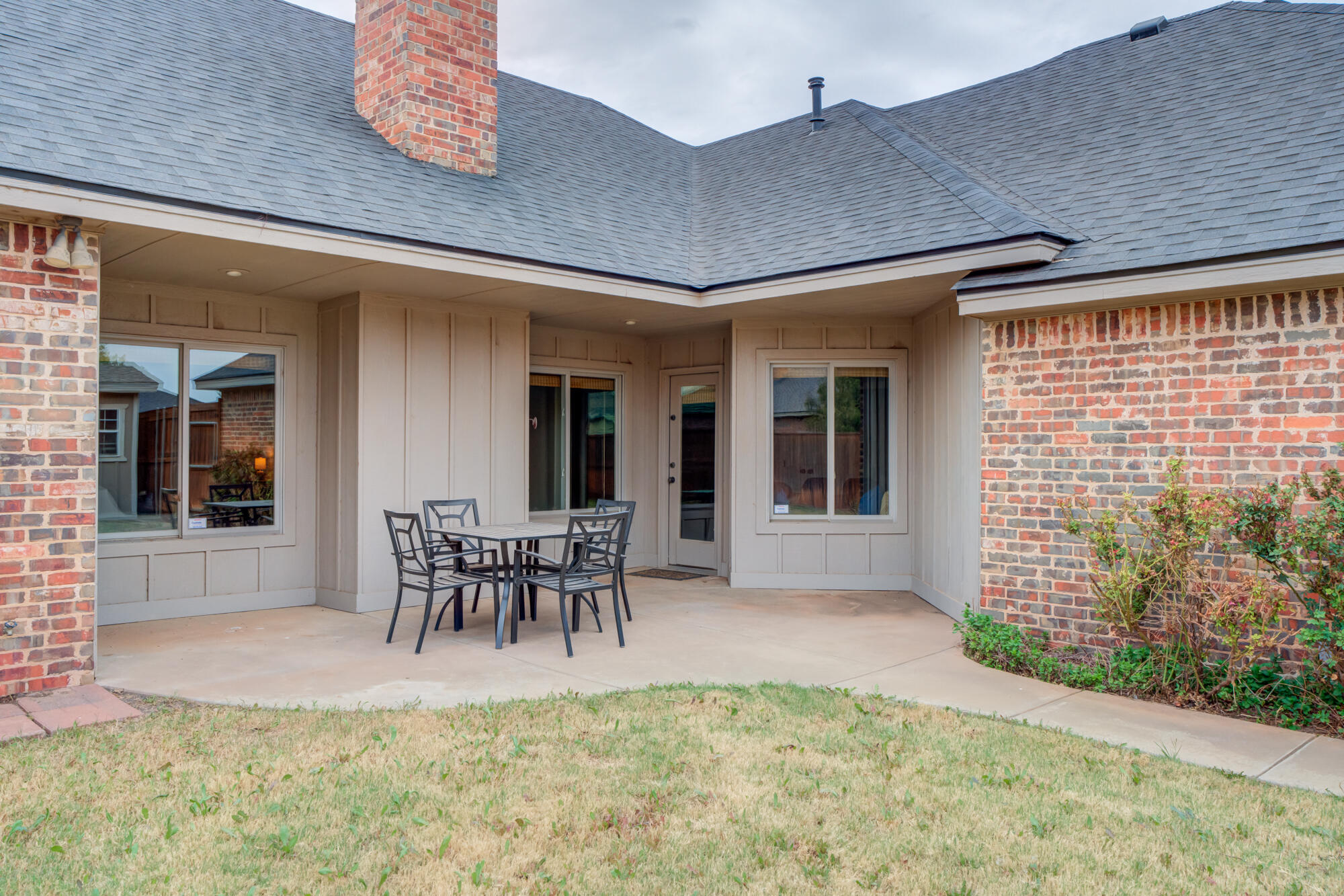 6020 85th Street Lubbock, TX 79424 - Photo 55 of 58 a view of a patio with table and chairs and potted plants