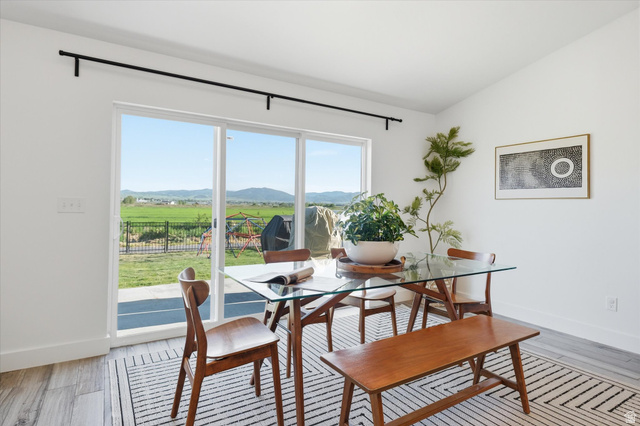 1422 West 3410th Street South Logan, UT 84321 - Photo 11 of 33 Expansive sliding glass doors open to a spacious outdoor area