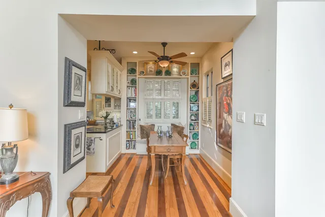 a kitchen with stainless steel appliances granite countertop white cabinets and a granite counter tops
