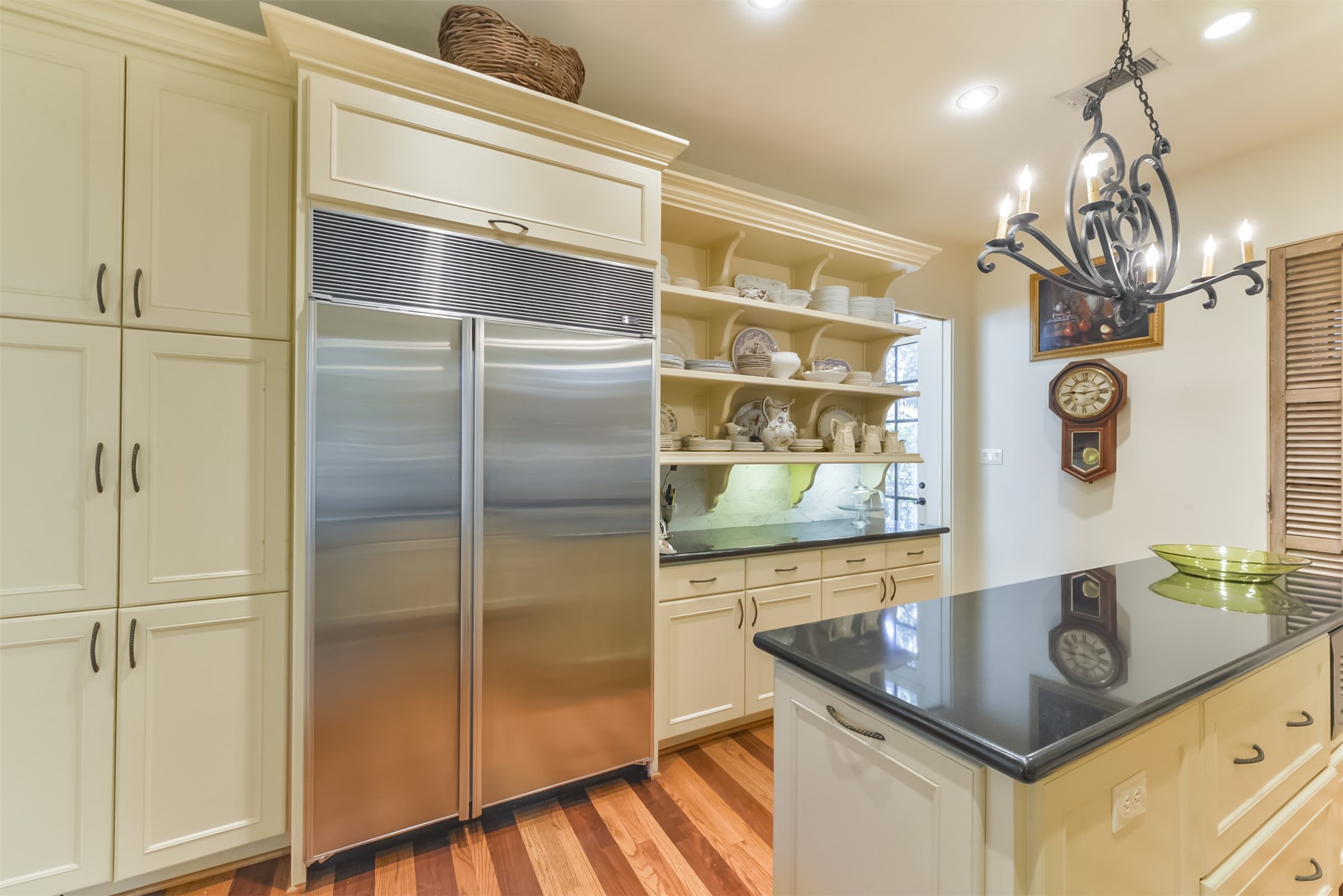 2712 Ferndale Street Houston, TX 77098 - Photo 16 of 49 a kitchen with stainless steel appliances granite countertop a sink and a refrigerator