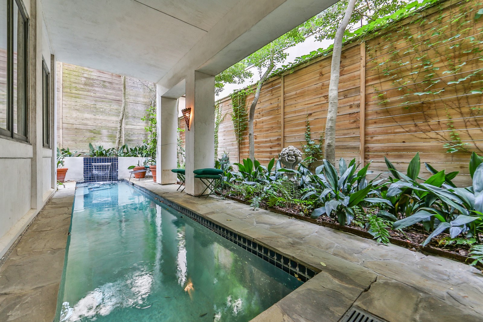 2712 Ferndale Street Houston, TX 77098 - Photo 2 of 49 a swimming pool with outdoor seating and plants