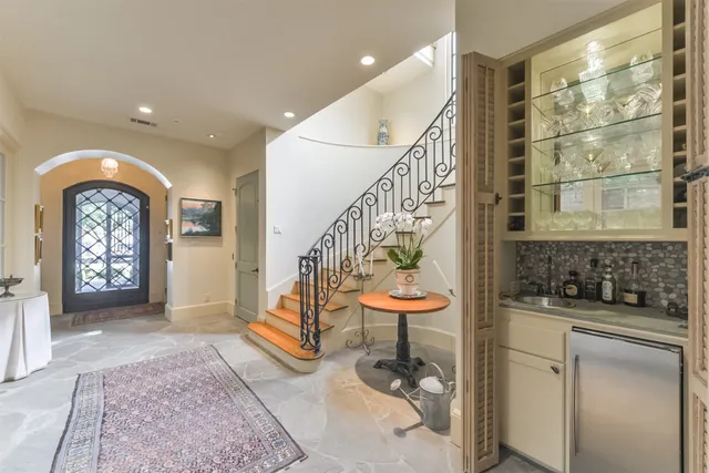 a view of entryway and hall with a bath tub