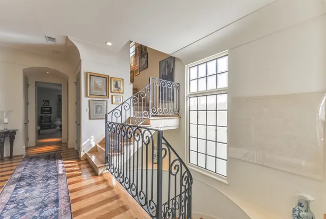 a living room with fireplace furniture and a chandelier