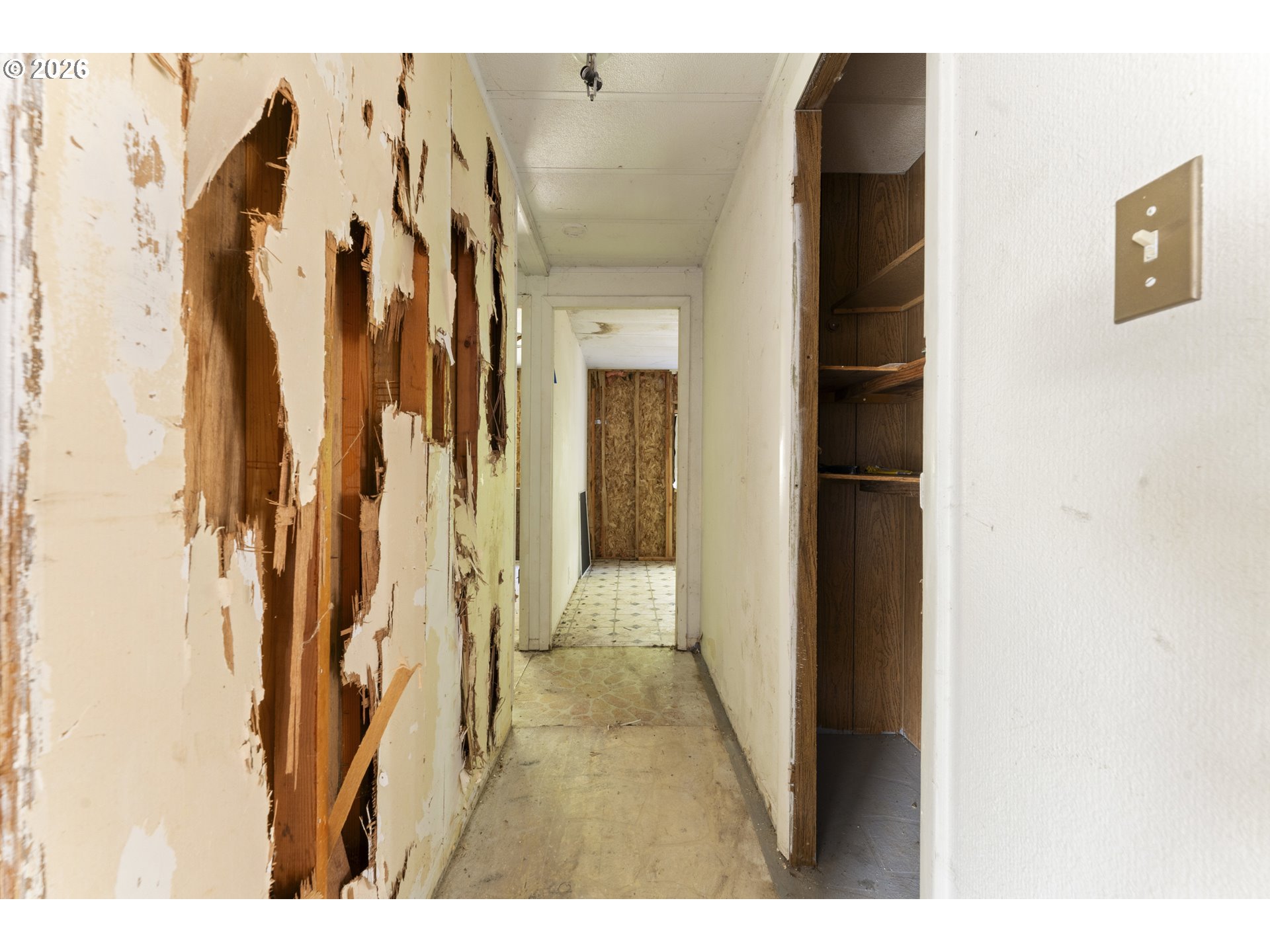 61912 Olive Barber Road Coos Bay, OR 97420 - Photo 14 of 31 a view of a hallway with wooden floor and door