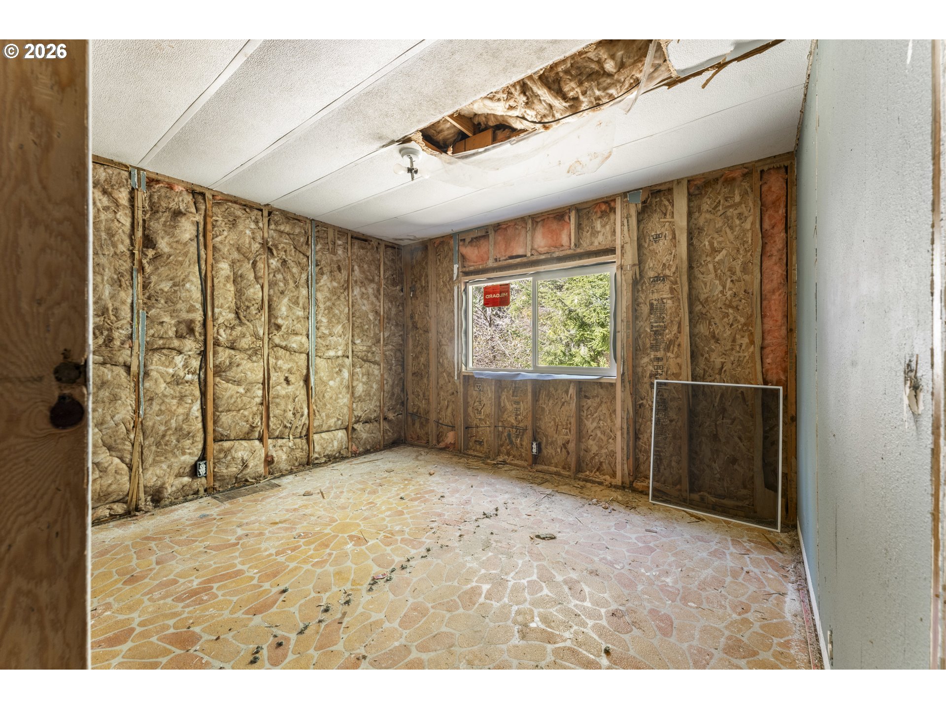 61912 Olive Barber Road Coos Bay, OR 97420 - Photo 16 of 31 a view of an empty room with a window