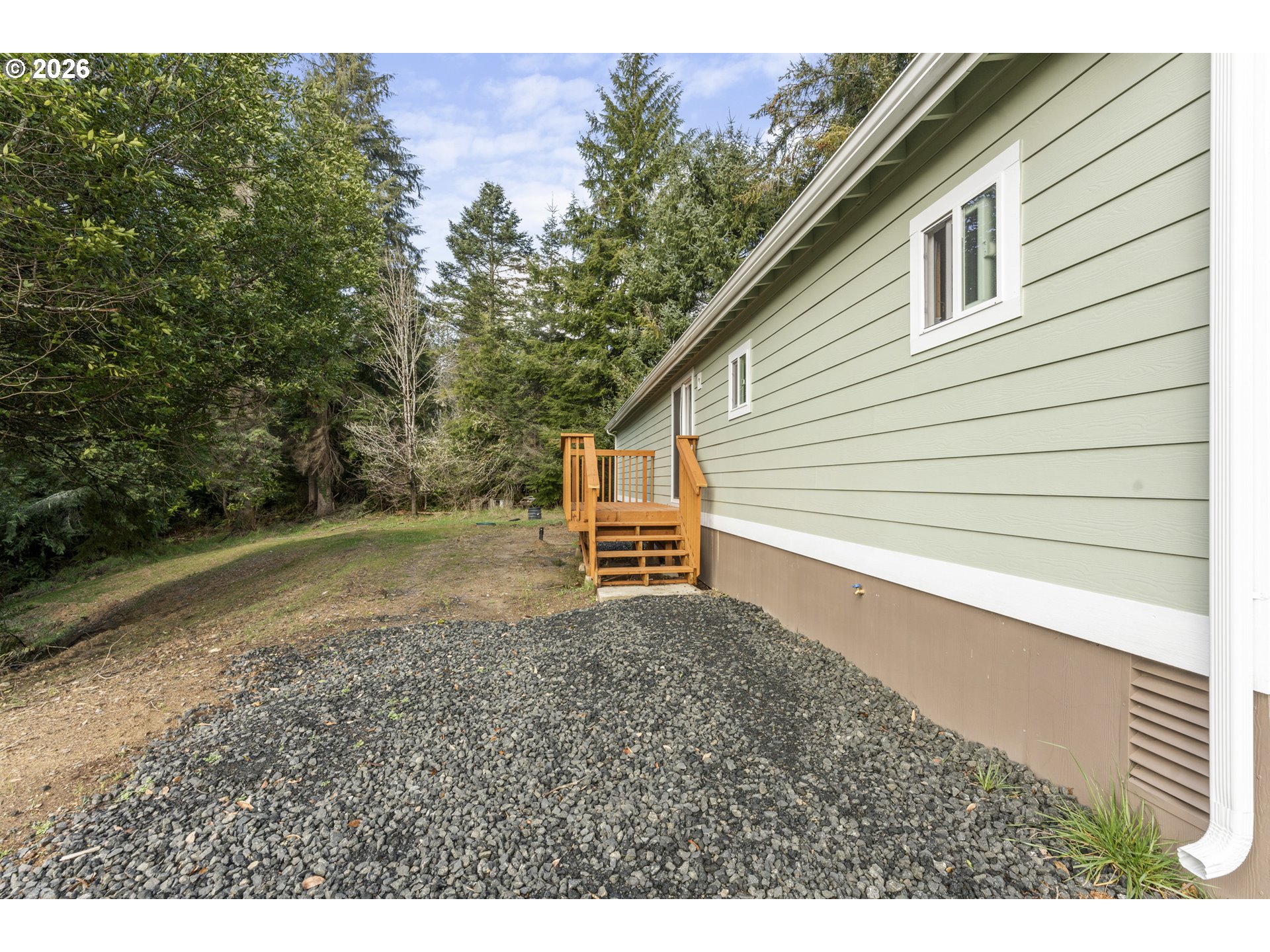61912 Olive Barber Road Coos Bay, OR 97420 - Photo 21 of 31 a view of backyard of house and trees