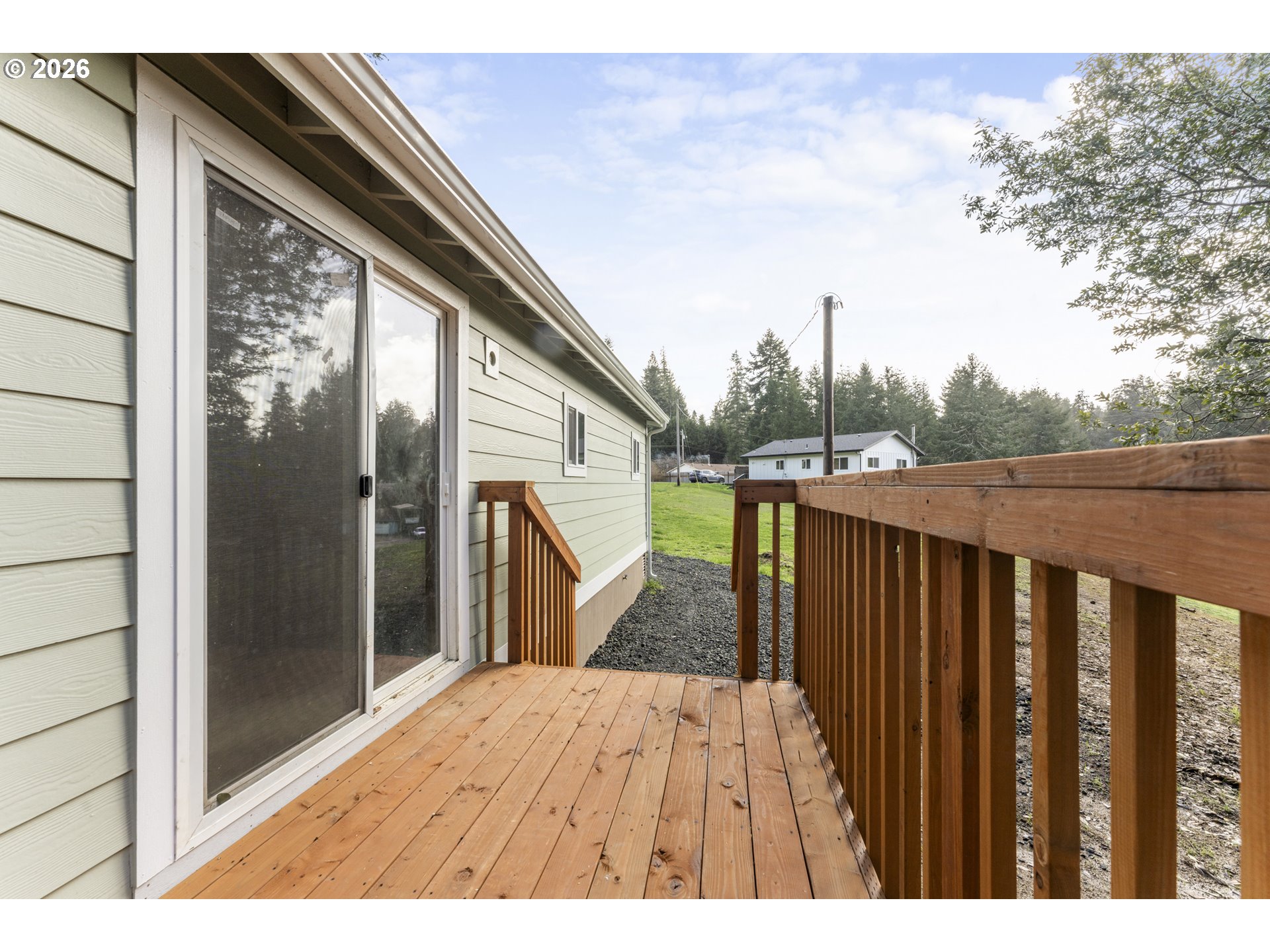 61912 Olive Barber Road Coos Bay, OR 97420 - Photo 22 of 31 a view of balcony and wooden floor