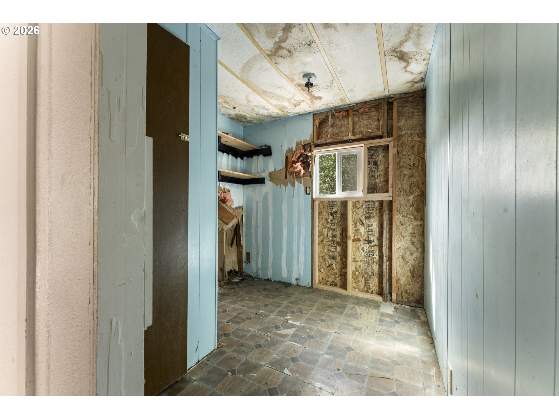 61912 Olive Barber Road Coos Bay, OR 97420 - Photo 8 of 31 a view of a hallway with wooden shelves