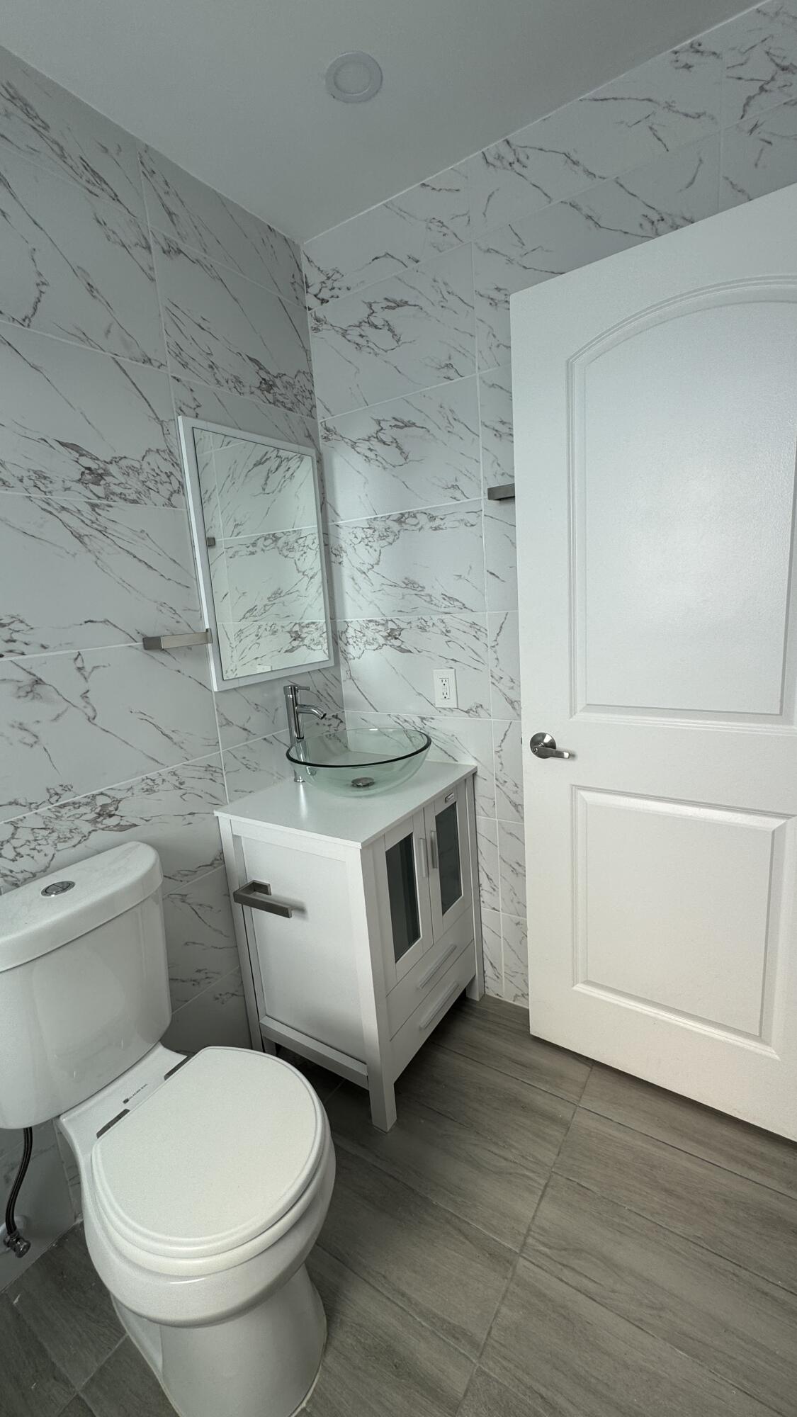 8395 Garden Gate Place Boca Raton, FL 33433 - Photo 11 of 35 a bathroom with a toilet and a tub