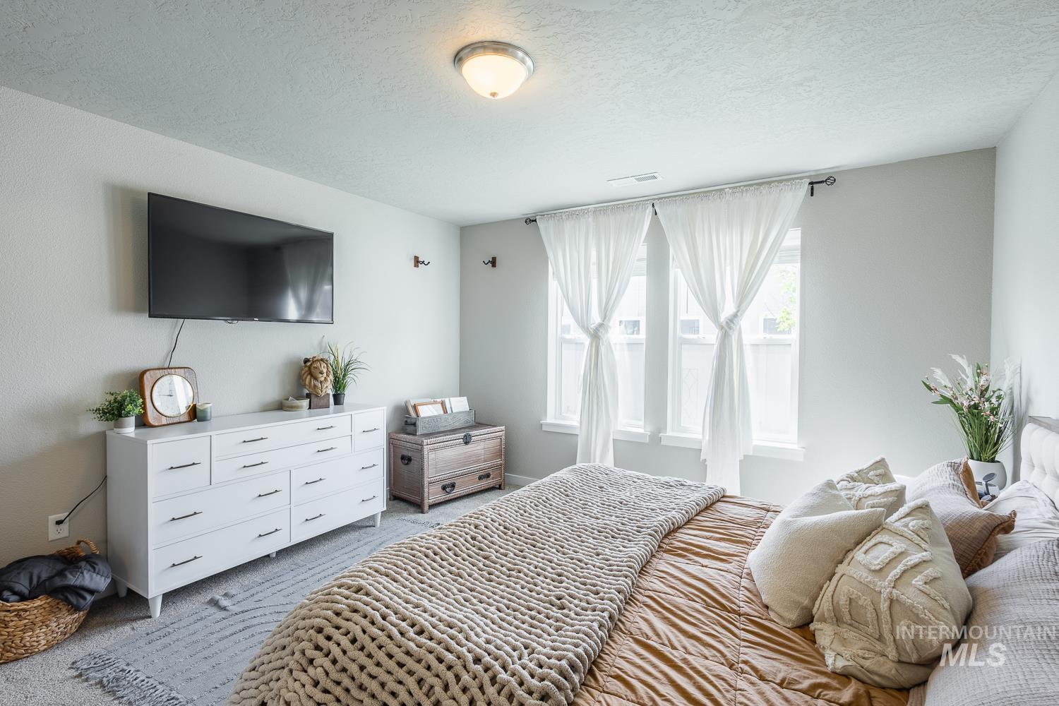 12623 Shadow Peak Street Caldwell, ID 83607 - Photo 26 of 50 Bedroom featuring two windows, recessed lighting, and light-toned walls