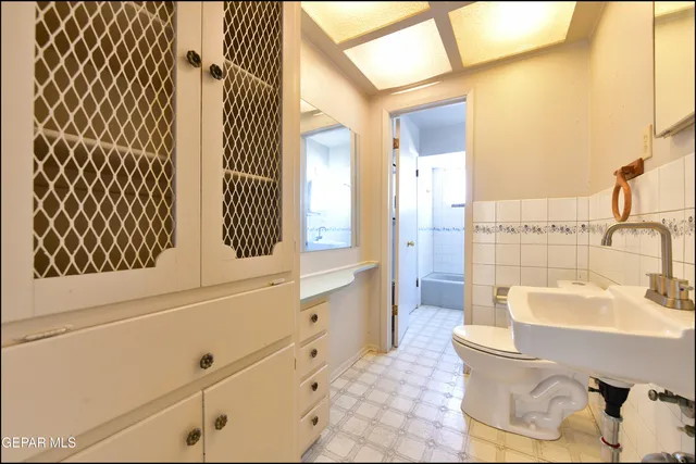 a bathroom with a bathtub and a sink