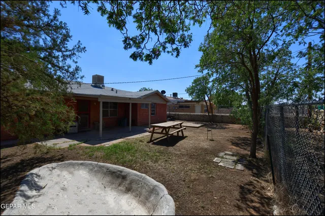 a view of a backyard with a sitting area