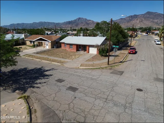 a view of houses with outdoor space and trees