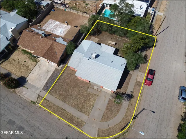 an aerial view of a house with outdoor space