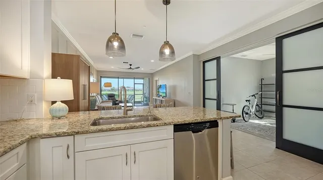 a large kitchen with a table and chairs