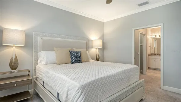 a bathroom with a granite countertop sink a large mirror and a shower