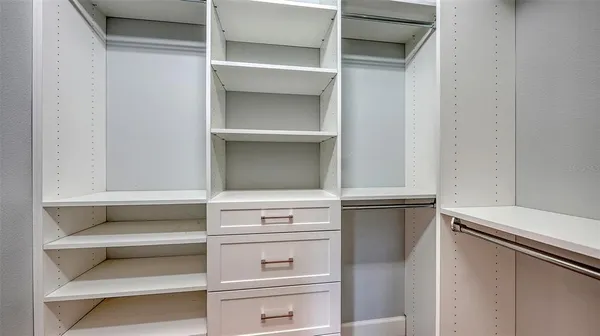 a bathroom with a granite countertop sink a toilet and a mirror