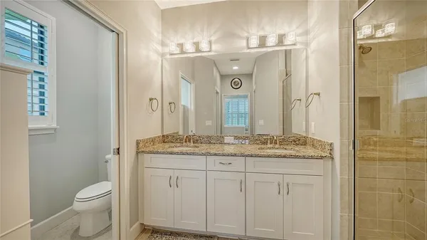 a view of a livingroom with furniture and a window