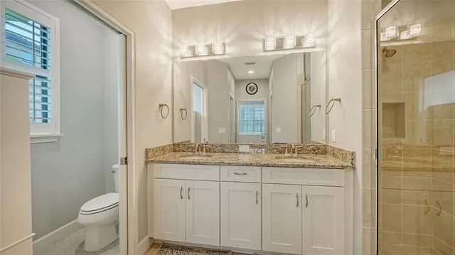 a view of a livingroom with furniture and a window