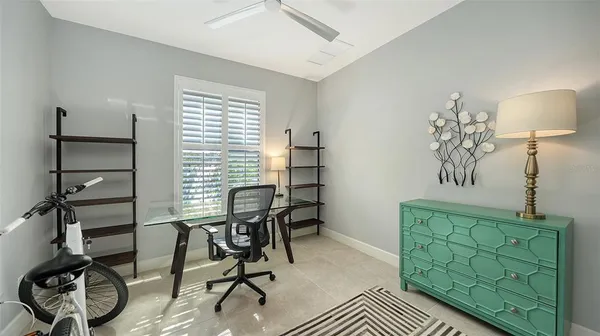 a living room with lots of furniture and view of kitchen