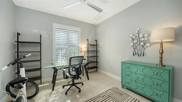 a living room with lots of furniture and view of kitchen