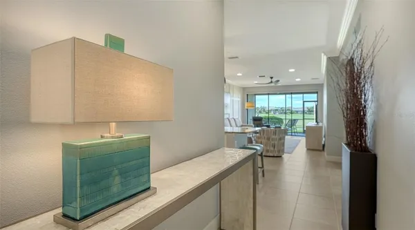 a room with a couch and a view of living room